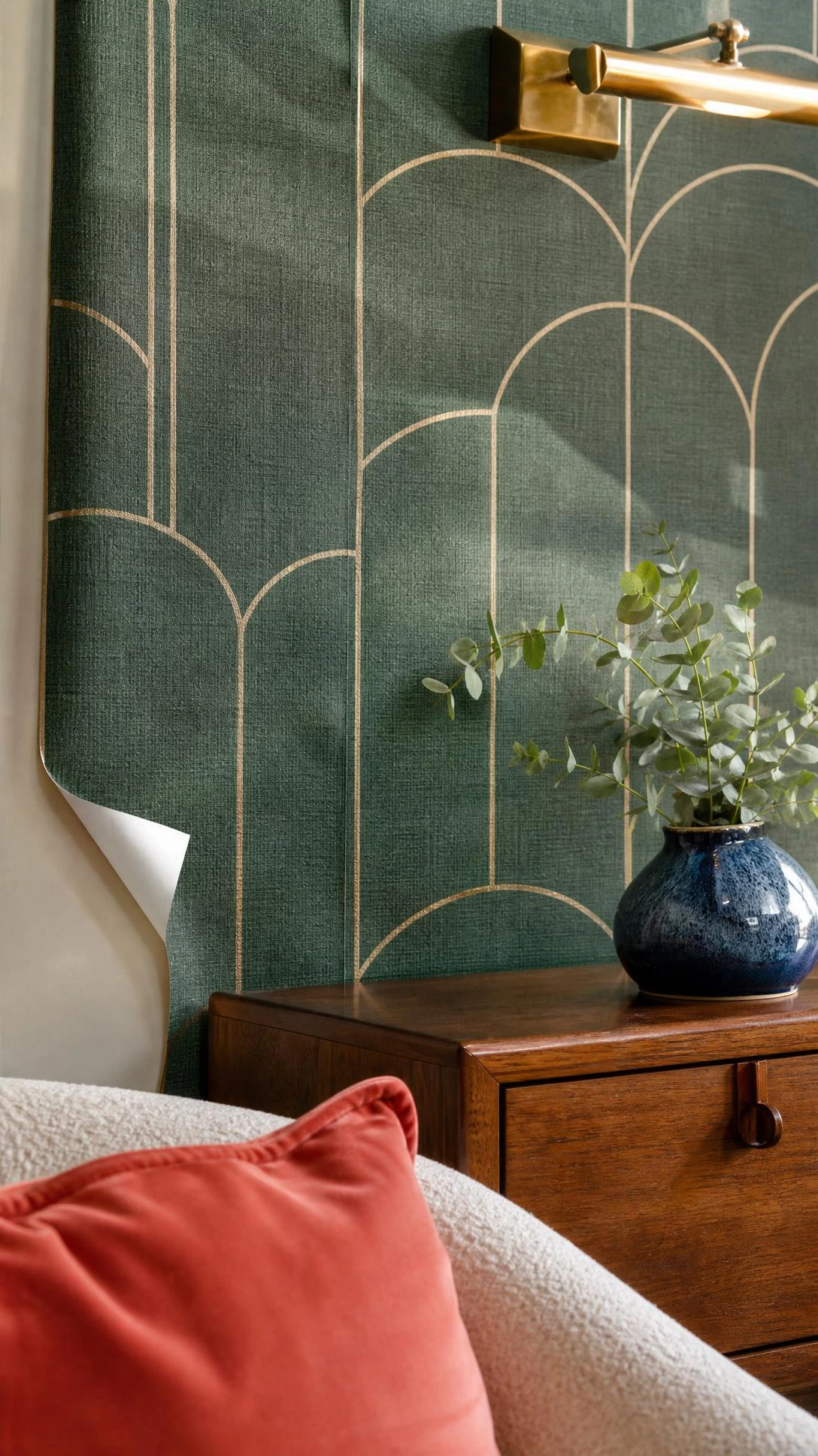 Emerald peel-and-stick accent wall with gold arches, linen texture, and a subtle seam above a thrifted walnut console