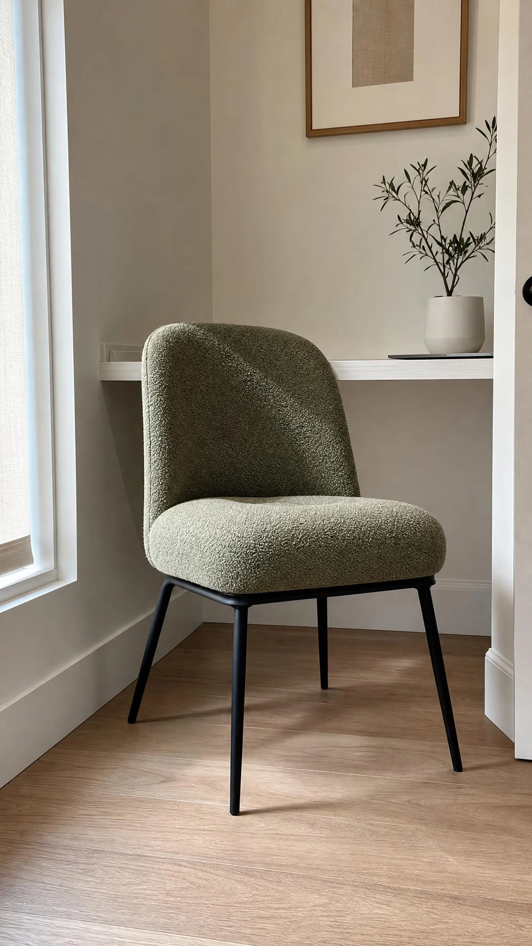 Compact ergonomic mid-century modern chair photographed from a low angle inside a small home office nook, showing how the right chair scale transforms a tight workspace