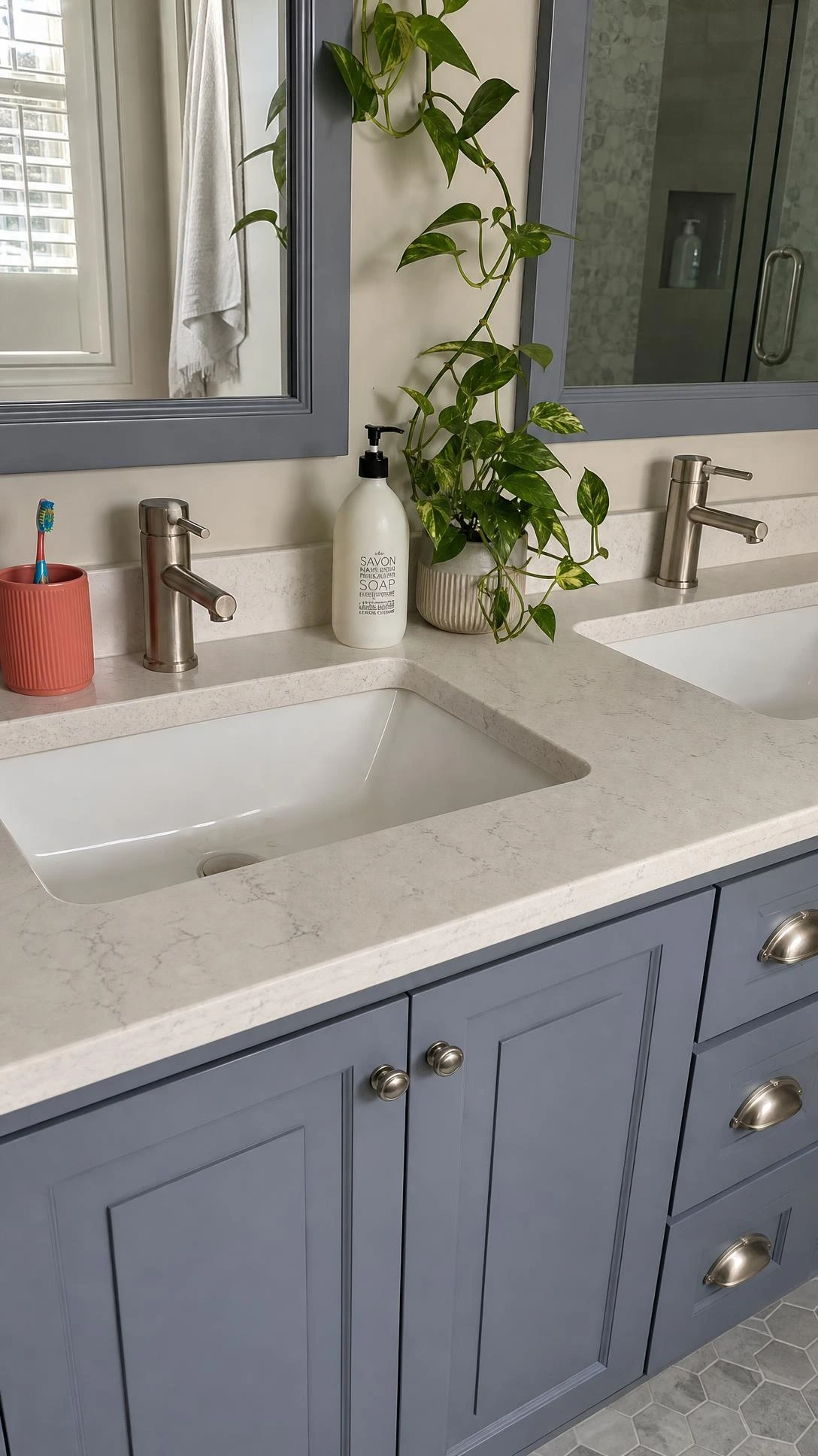 Sleek double basin vanity with twin undermount sinks and brushed chrome faucets — a practical family bathroom solution for busy morning routines