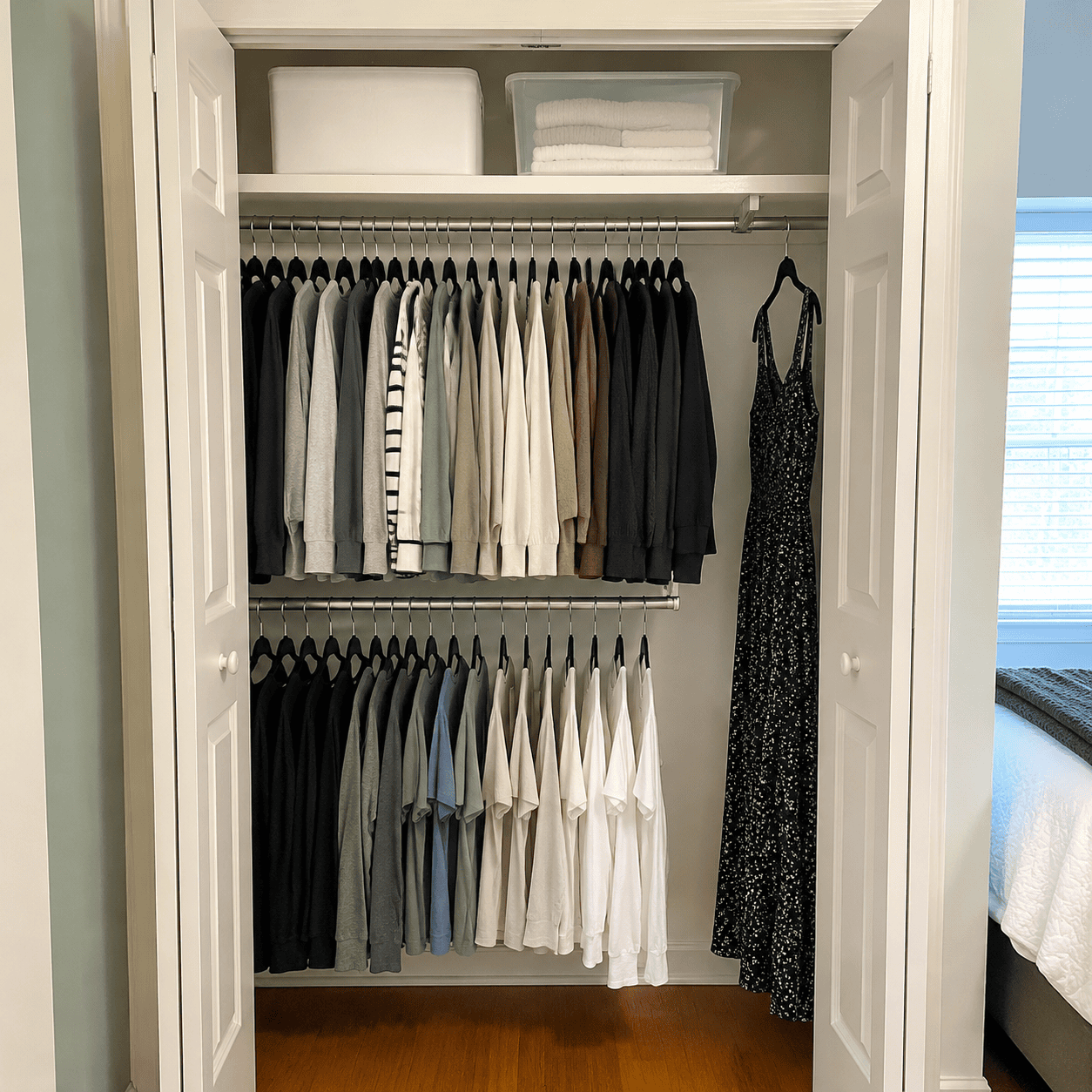 Bedroom closet organized with a double hanging rod