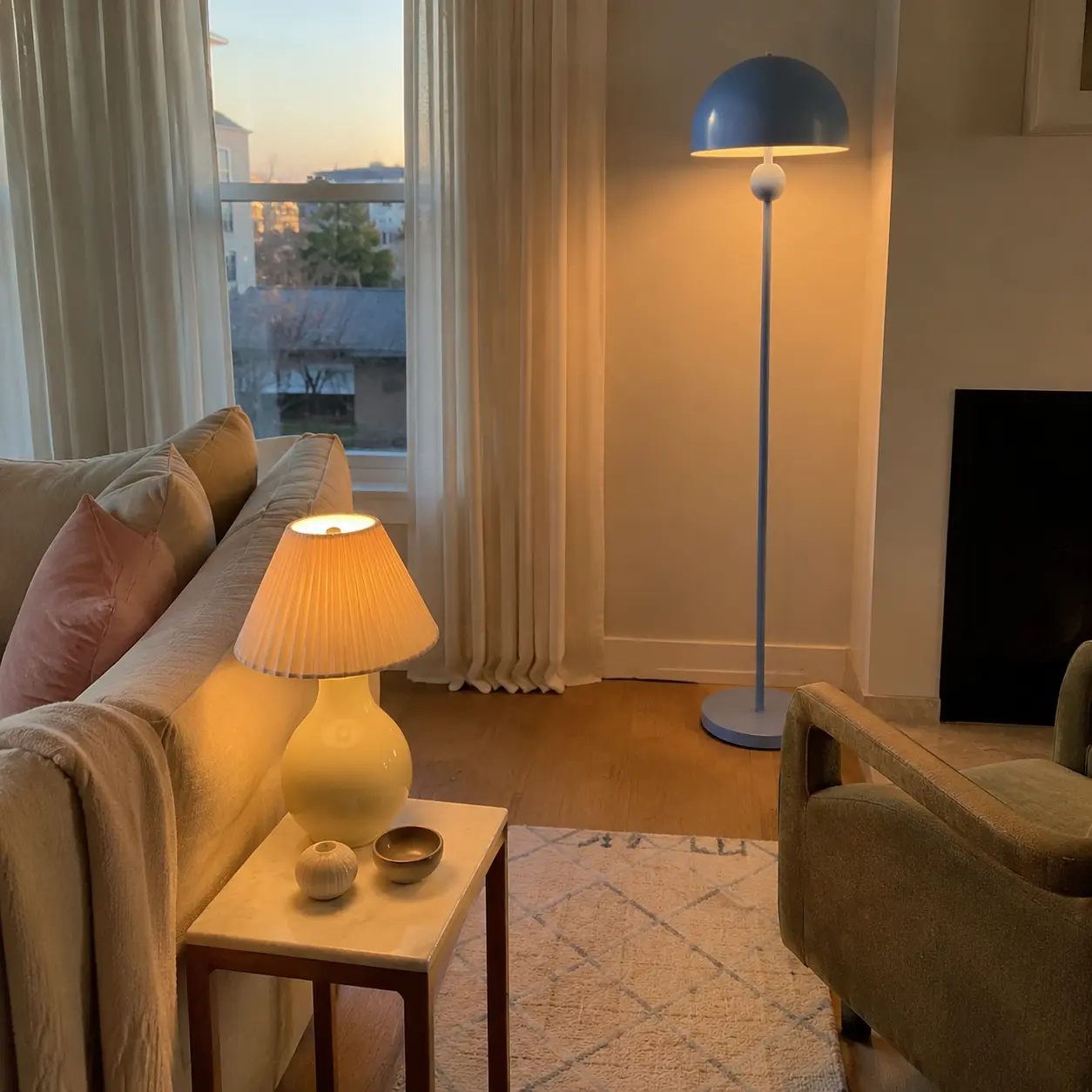 Pastel table and floor lamps creating warm living room lighting