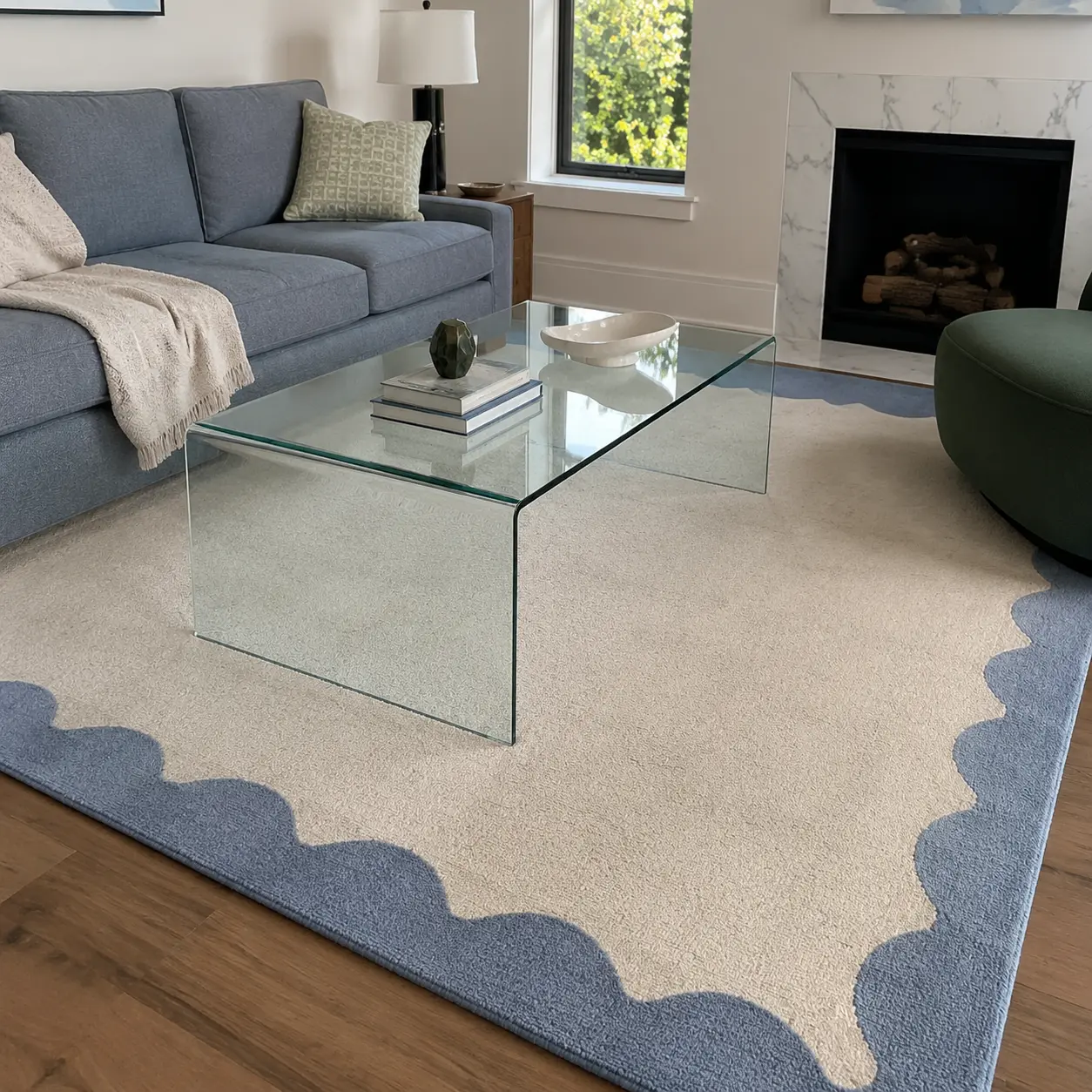 Cream living room rug with a dusty blue scalloped border