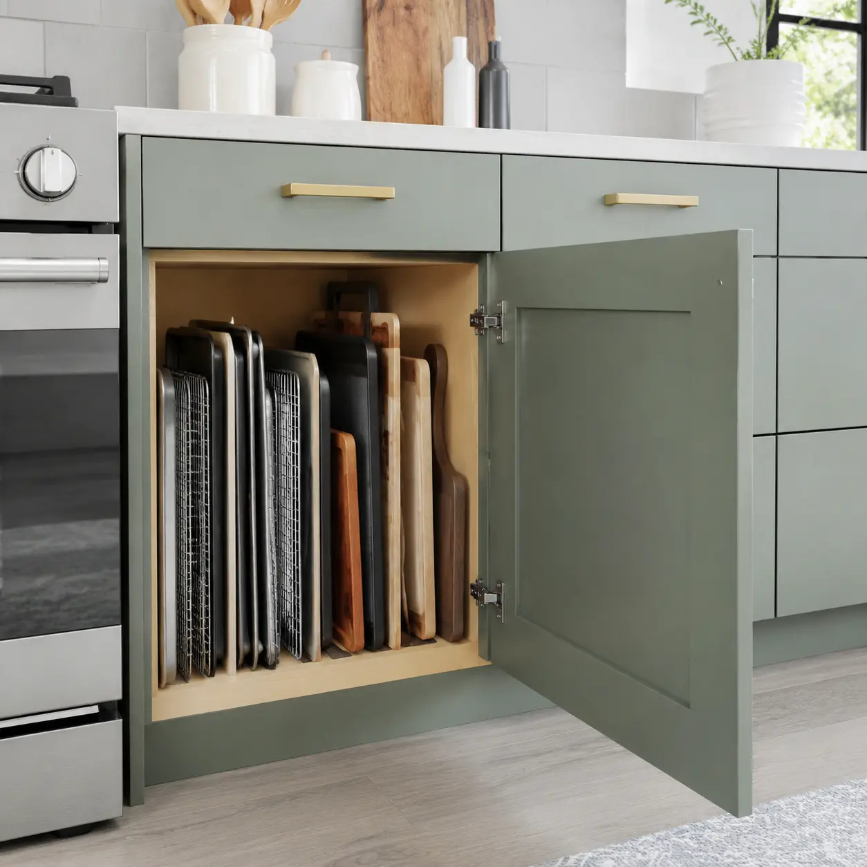 Vertical cabinet dividers organizing baking trays and cutting boards